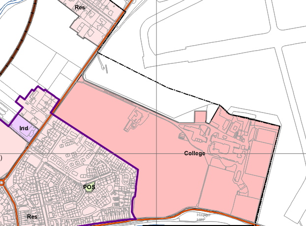 A planning map showing land use designations such as residential, industrial, and college areas, with a purple boundary line outlining the application site.