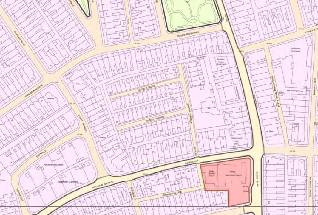 A site location plan showing a residential area with terraced housing and a highlighted plot containing a church.