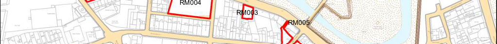 A site plan showing street layouts, building footprints, and specific plots highlighted in red outlines near a watercourse.