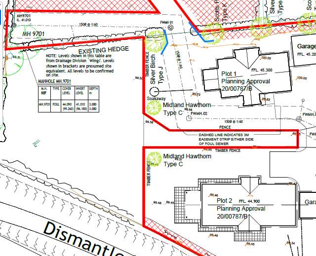 A detailed site plan showing property boundaries, existing approved plots, drainage features like a soakaway, and landscaping elements.