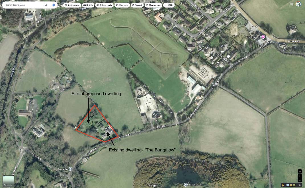 Aerial site location map showing the proposed development area outlined in red, with labels indicating the site of a proposed dwelling and an existing bungalow.