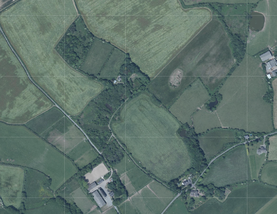 Aerial site location map showing a rural plot surrounded by fields, hedgerows, and nearby buildings.