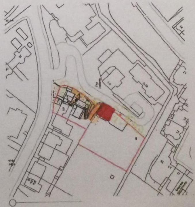 A site plan showing the proposed development site highlighted in red and orange, surrounded by existing building footprints and roads.