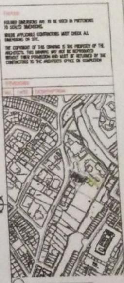 A site plan showing the layout of surrounding properties, roads, and a highlighted green area indicating the proposed development site, accompanied by standard drawing title block text.