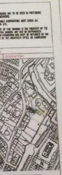 The image shows a document page containing a site location map at the bottom, depicting property boundaries, roads, and surrounding buildings with a specific plot highlighted. The top section includes legal text regar...