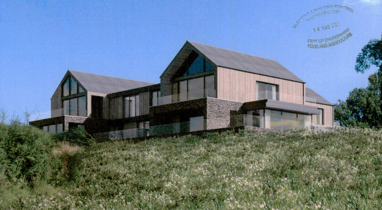 A modern, multi-level building with wood and stone cladding situated on a grassy hillside under a blue sky.
