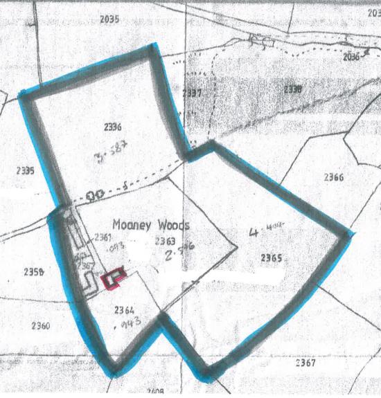 A scanned site plan map showing the boundaries of Moaney Woods Farm highlighted in blue with a red building footprint.