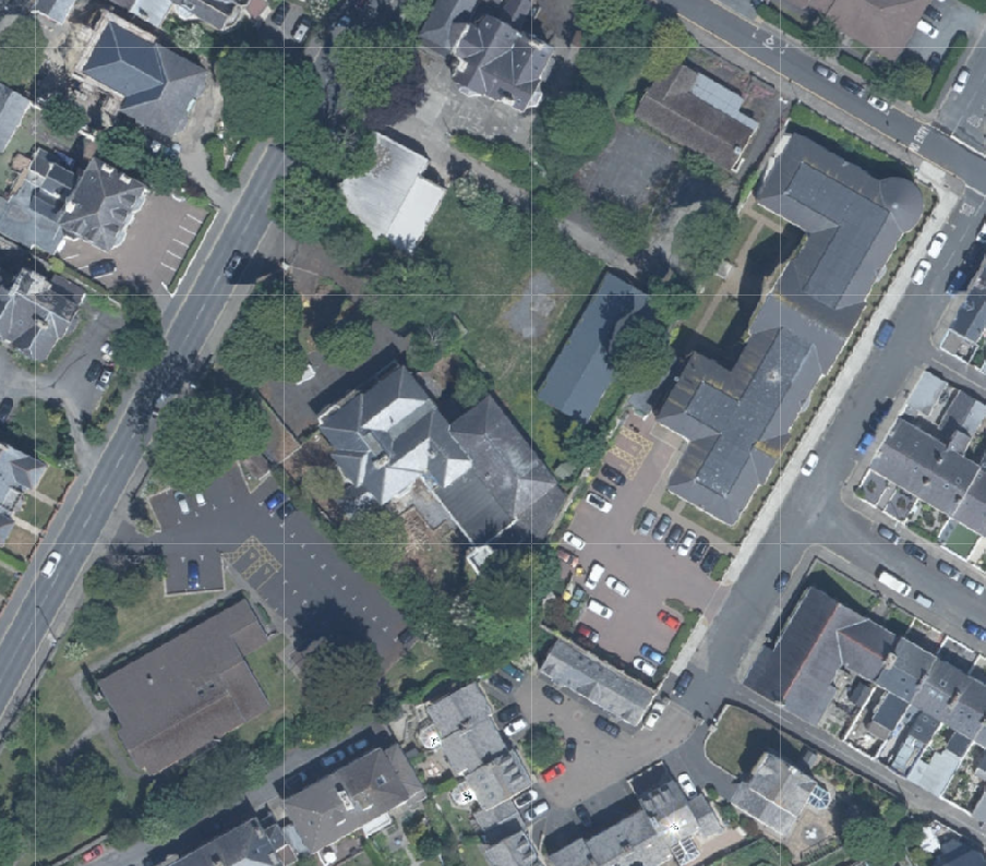 Aerial site location map showing the property and surrounding residential area with roads and parking lots.