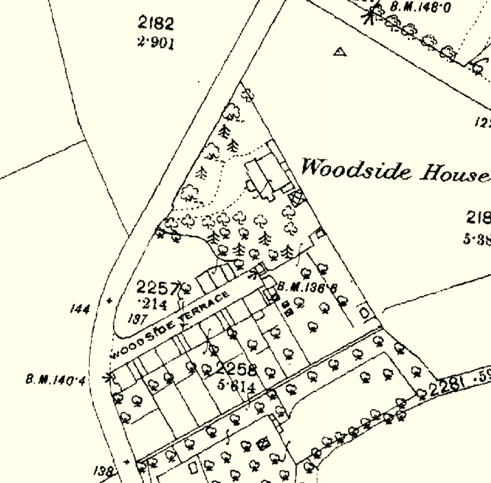A black and white site plan or OS map extract showing property boundaries, trees, and building footprints for Woodside House.