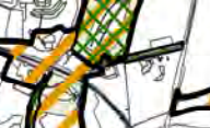 This image displays a zoomed-in section of a site plan or location map featuring distinct areas marked with green and yellow cross-hatching over black line drawings of boundaries and structures.