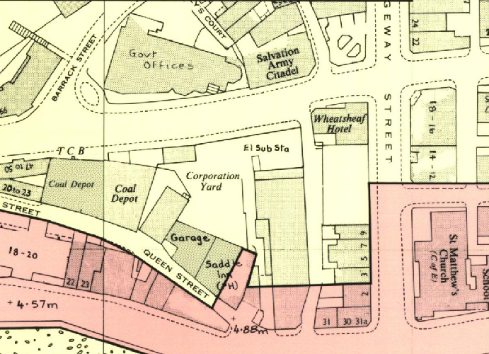 This image displays a cropped section of a historical map or site plan, featuring street names like Queen Street and Barrack Street, along with labeled buildings such as the Wheatsheaf Hotel and St Matthew's Church.