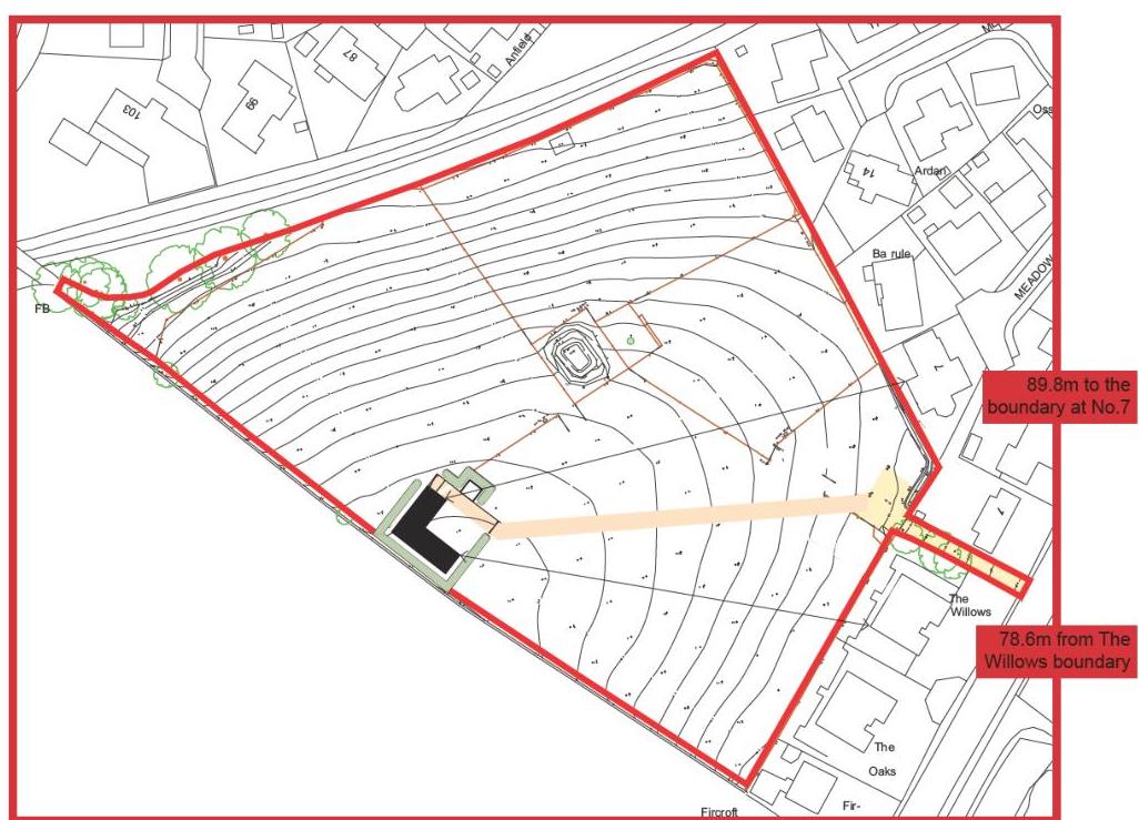 A site plan showing a property boundary outlined in red with topographical contour lines, indicating proposed structures and access paths.