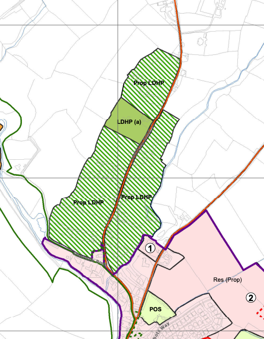 A planning map showing land use designations including proposed housing areas and residential zones with colored boundaries.