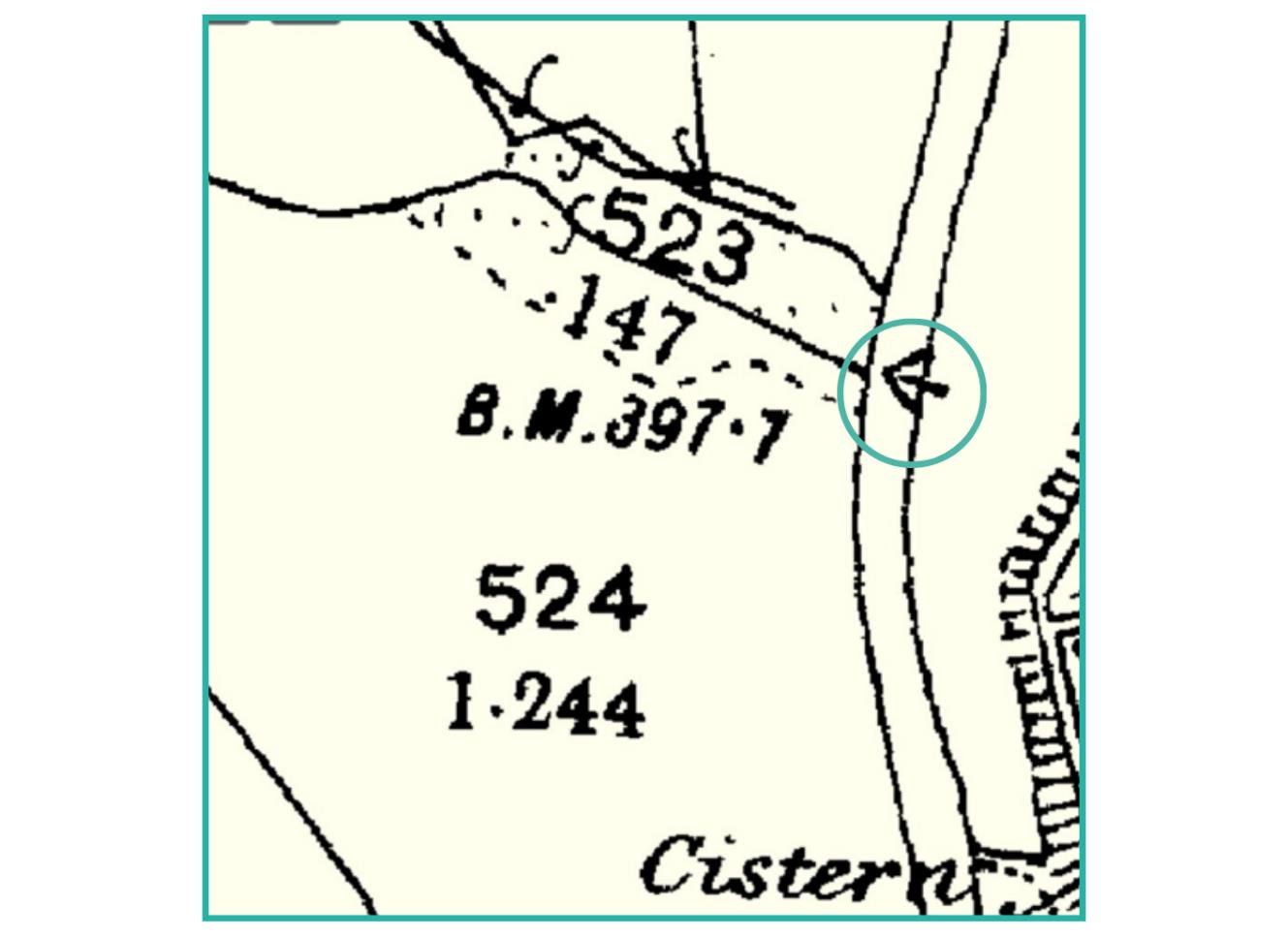 A detailed extract from a site plan or OS map showing field boundaries, numerical annotations, and a specific point highlighted with a circle and arrow.