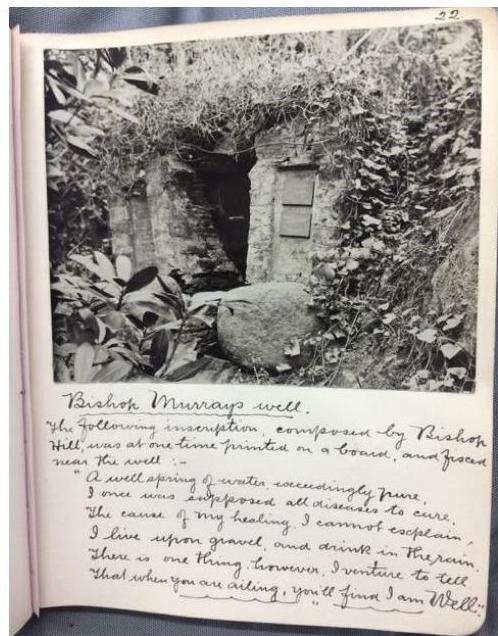 A scanned page featuring a black and white photograph of a stone well surrounded by foliage, with handwritten notes below titled 'Bishop Murrays well'.