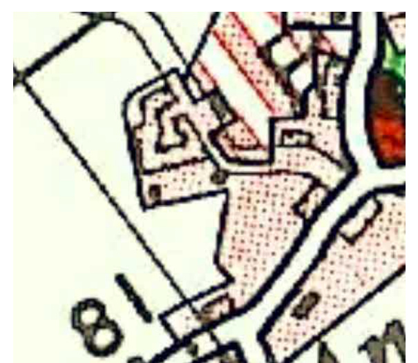 Close-up view of a site plan showing property boundaries, building footprints, and hatched land areas.