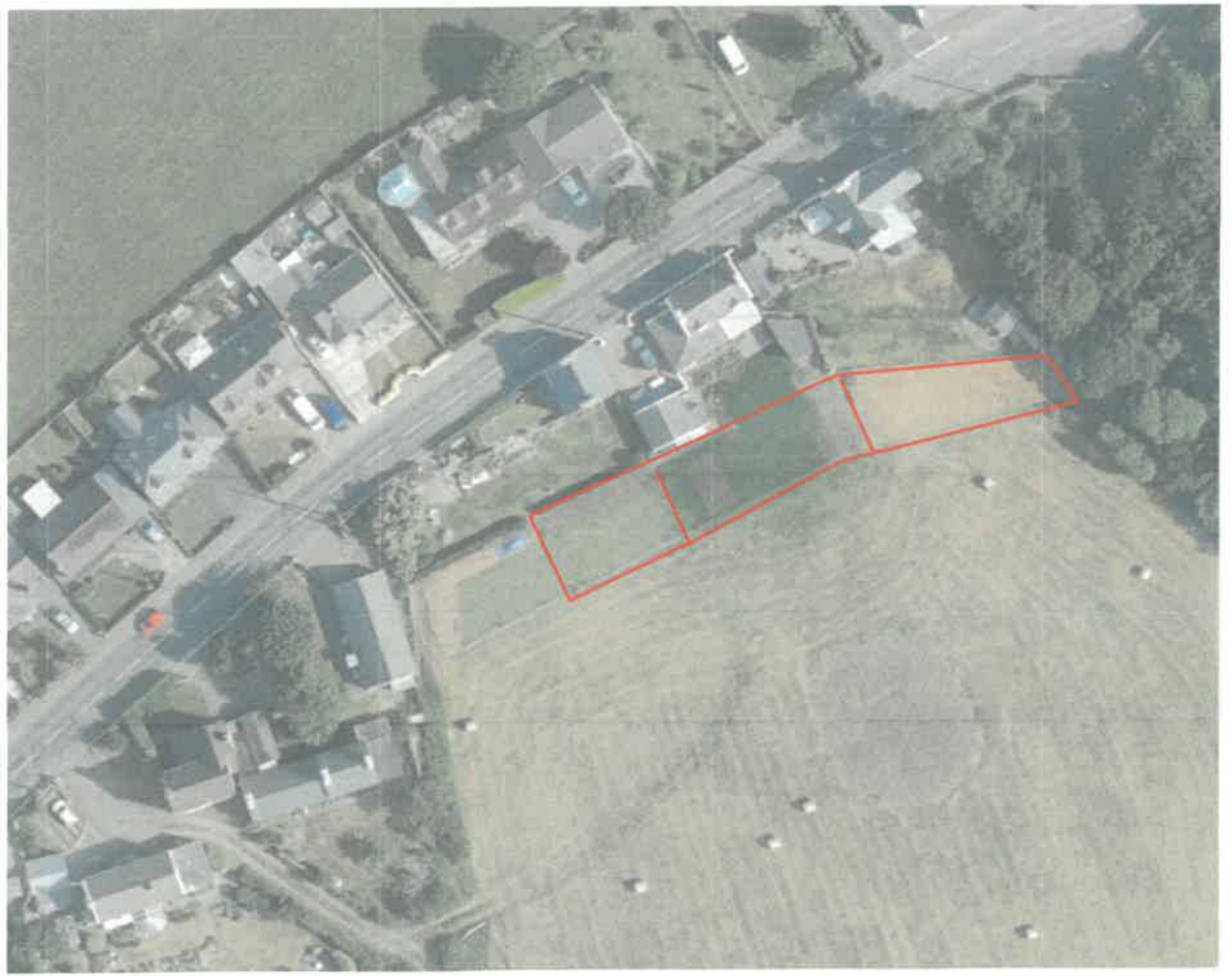 Aerial view site plan showing red outlined areas extending the curtilage of a property into an adjacent field.