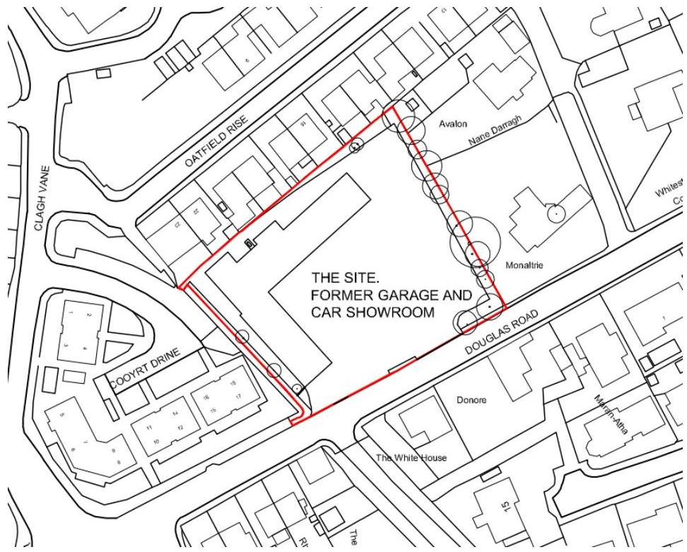 A site plan highlighting a specific plot of land outlined in red, identified as the 'Former Garage and Car Showroom' at the junction of Douglas Road and Oatfield Rise.