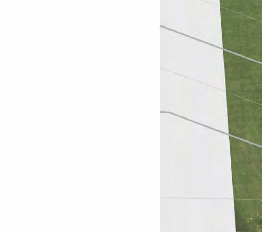 A cropped section of a site plan showing a white rectangular area, likely a building or driveway, adjacent to a green grassy area with faint boundary lines.