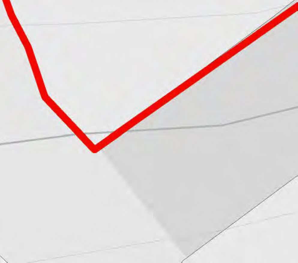 A zoomed-in section of a site plan showing faint grey property boundaries and a prominent red line highlighting a specific boundary or area.