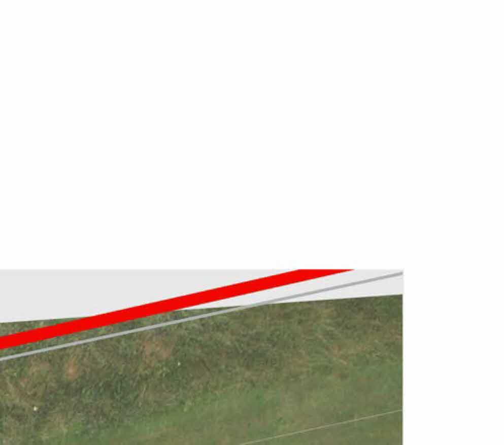 A cropped section of a site plan showing a grassy field with red and grey boundary lines overlaid.