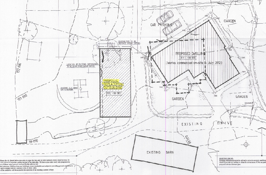 A site plan illustrating the layout of a rural property, highlighting the location of an existing barn and a proposed replacement outbuilding.