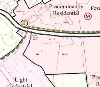 A site location map showing land use designations including 'Light Industrial' and 'Predominantly Residential' areas with road networks and boundaries.