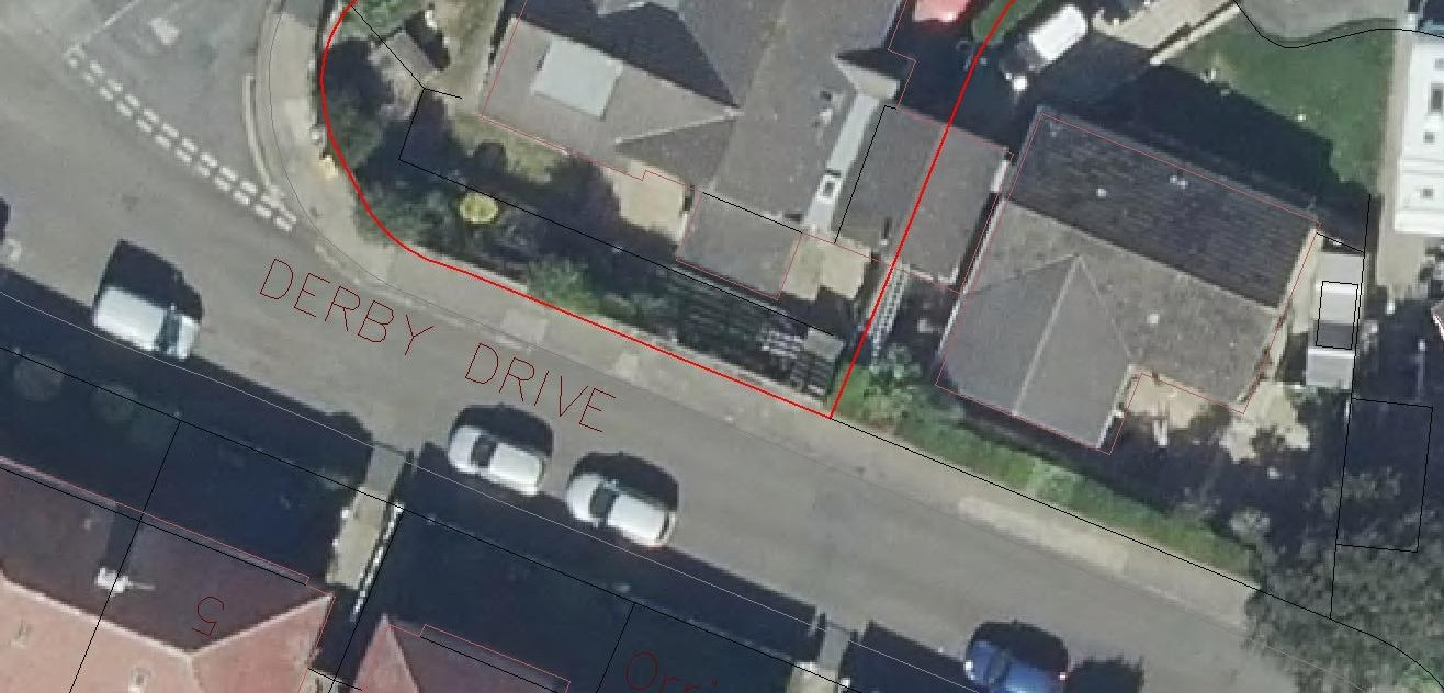 Aerial site plan showing property boundaries outlined in red along Derby Drive.