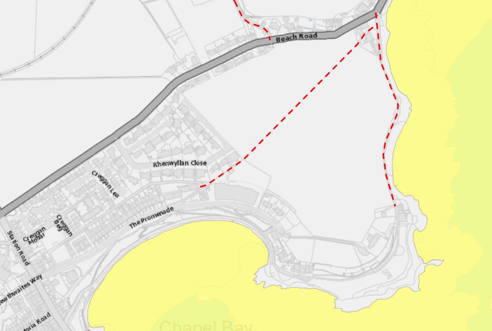 A site location plan showing a coastal plot of land outlined in red dashed lines near Beach Road and Chapel Bay.