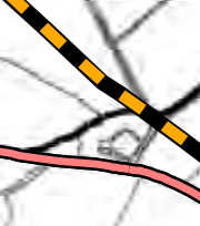 A close-up extract from a site plan showing boundary lines, a railway or major road, and faint field divisions.