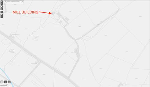 A site location map displaying field boundaries and roads with a red arrow pointing to the existing mill building.