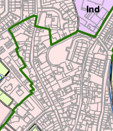 A site location map showing a property boundary outlined in green, surrounded by residential streets and an industrial zone labeled 'Ind'.