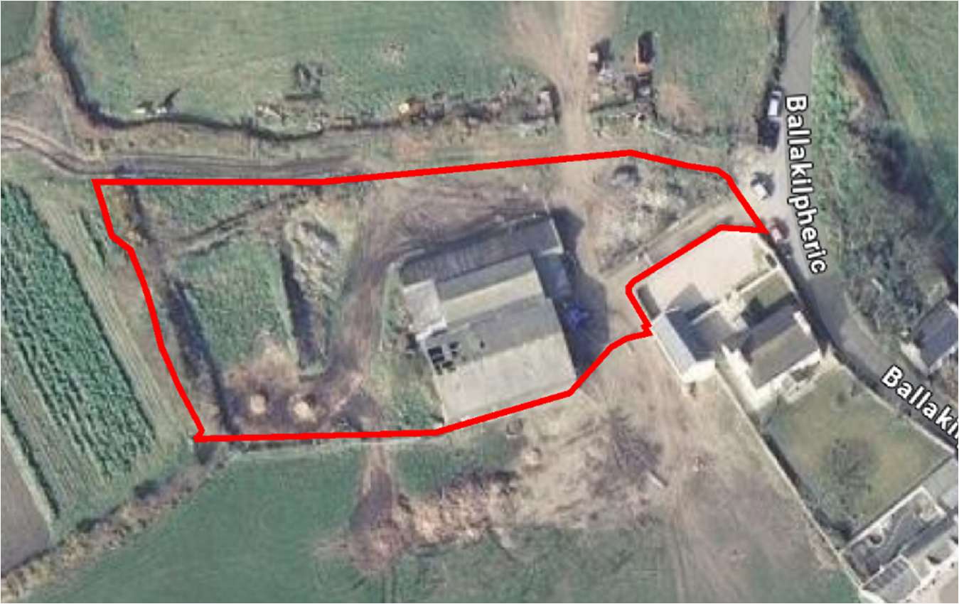 Aerial site plan showing a red boundary line outlining a plot containing a large agricultural barn and surrounding fields near Ballakilphere road.