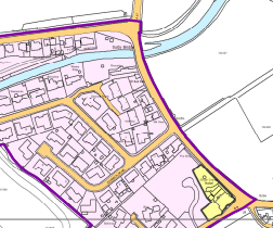 A site plan showing a specific plot highlighted in yellow within a residential area, surrounded by existing housing outlines and boundary lines.