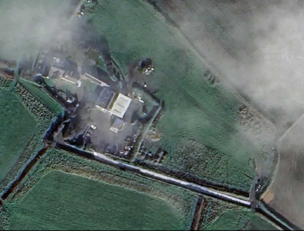 An aerial photograph showing a rural site with buildings, hardstanding areas, and surrounding fields, illustrating the location of the proposed arboricultural business.