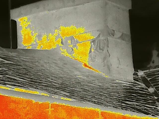 A thermal image or heat map showing the exterior wall and roof of a building, likely used for a bat roost survey.