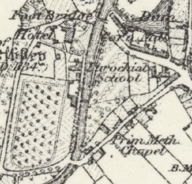 A historical black and white map showing field boundaries, trees, and buildings including a school and chapel.