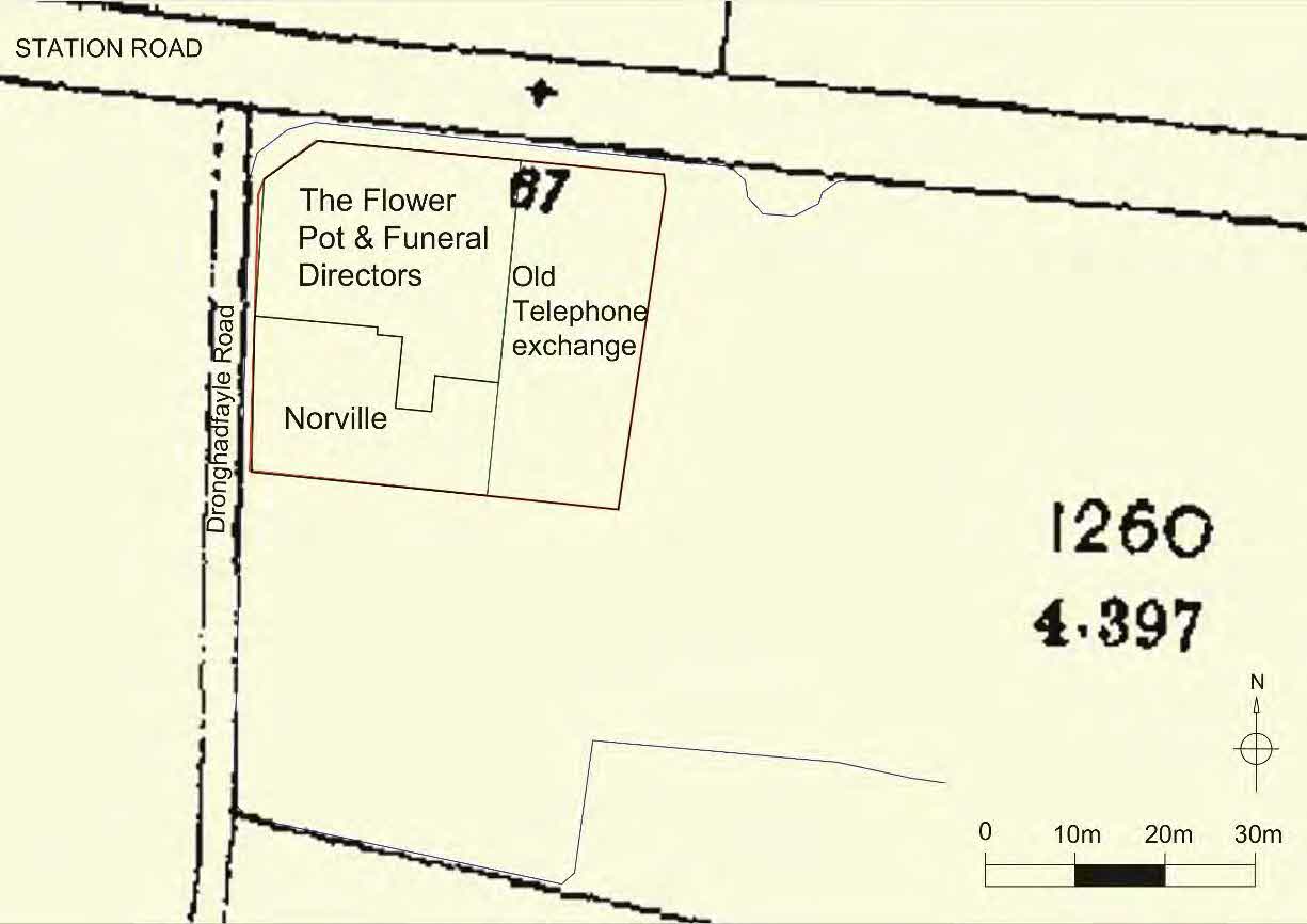 A site plan showing property boundaries and building footprints for commercial properties including a funeral director and telephone exchange along Station Road.